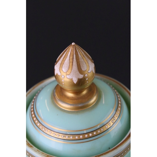 23 - Victorian Pale Green Opaque Glass Lidded Urn with hand painted enamelled decoration of two birds sat... 