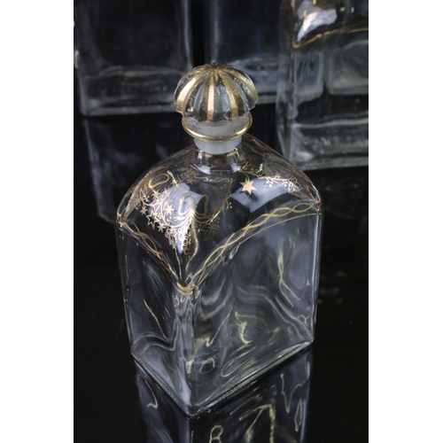 25 - Five Spanish Glass Liquor Decanters and stoppers with gilt decorations marked to base Jerez, Spain, ... 