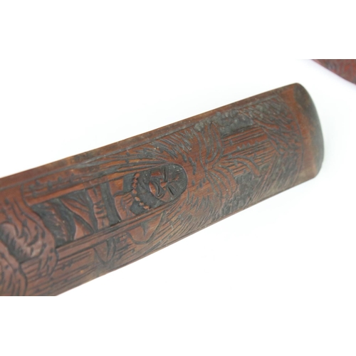 109 - A collection of three oriental bamboo page turners with ornate carved decoration.