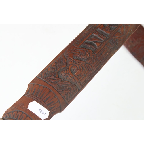 109 - A collection of three oriental bamboo page turners with ornate carved decoration.