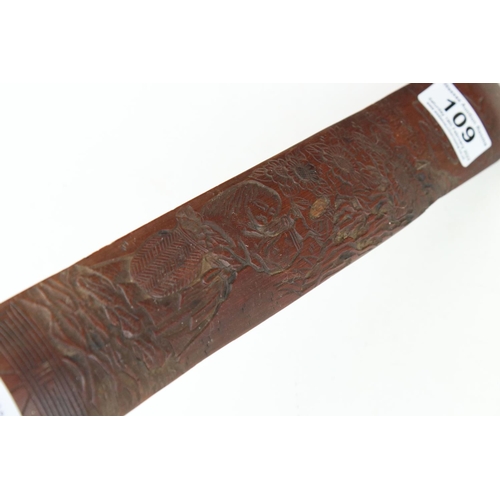 109 - A collection of three oriental bamboo page turners with ornate carved decoration.