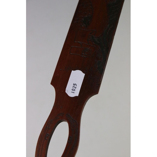 109 - A collection of three oriental bamboo page turners with ornate carved decoration.