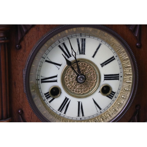 111 - An antique wooden cased chiming bracket clock.