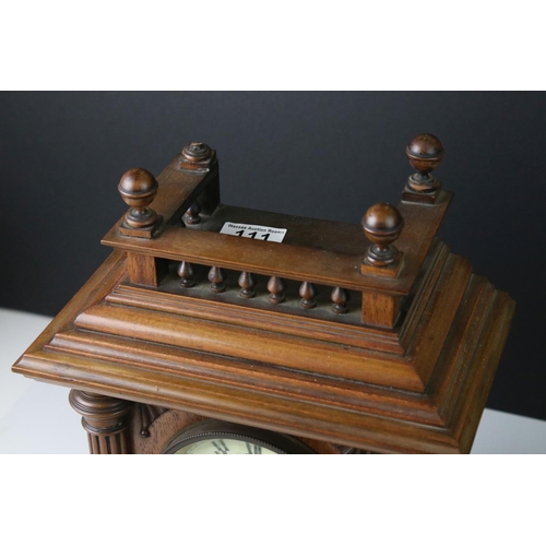 111 - An antique wooden cased chiming bracket clock.