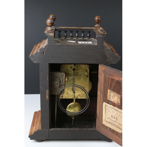 111 - An antique wooden cased chiming bracket clock.