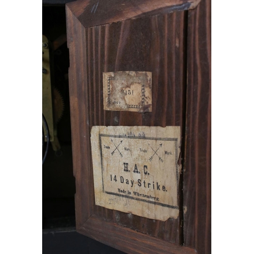 111 - An antique wooden cased chiming bracket clock.