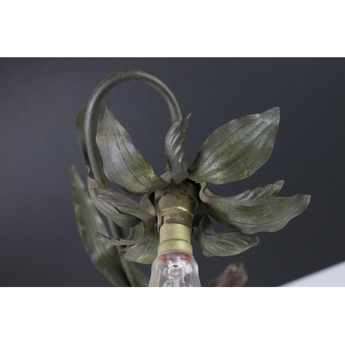 89 - An early 20th century cast lamp in the form of a flower and cherub.