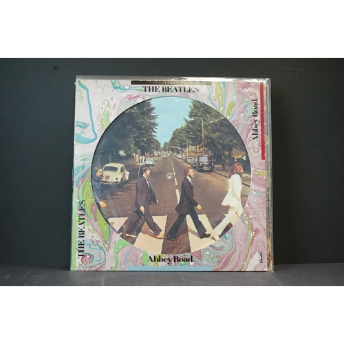 39 - Vinyl - The Beatles 2 picture discs, 9 LP's and one book.  Picture discs are Abbey Road (SEAX 11900)... 