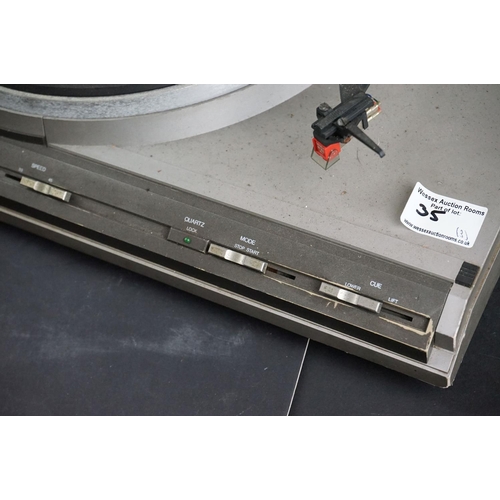 35 - Three Garrard turntables / record decks, to include AT 60 with plastic dust cover, GT-35P & DQ-100 Q... 