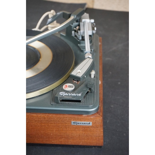 35 - Three Garrard turntables / record decks, to include AT 60 with plastic dust cover, GT-35P & DQ-100 Q... 