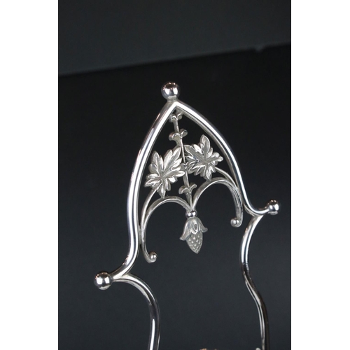 106 - An antique silver plated cruet / condiment centre piece with decorative etched glass bottles.