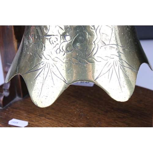 108 - Brass engraved Temple Bell with striker held on a Hardwood Stand, 34cm high