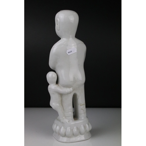 68 - Blanc de Chine Figure of a Chinese Man holding a Vase with Child, 32cm high