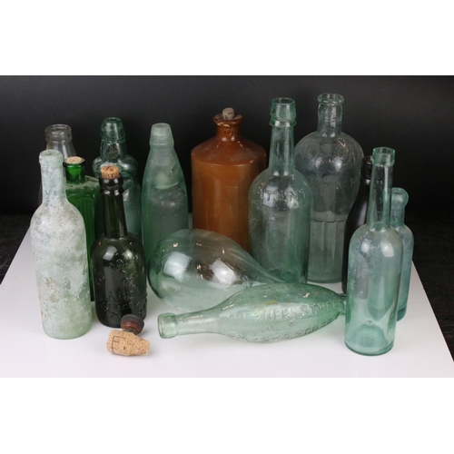 81 - Thirteen 19th and Early 20th century Glass Bottles including Poison and Lemonade plus a Stoneware Bo... 