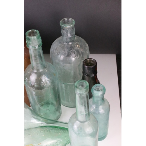 81 - Thirteen 19th and Early 20th century Glass Bottles including Poison and Lemonade plus a Stoneware Bo... 