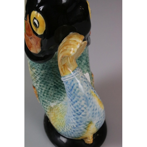 11 - Two Gurgle Jugs, one Royal Winton 22cm high and the other Majolica 22cm high
