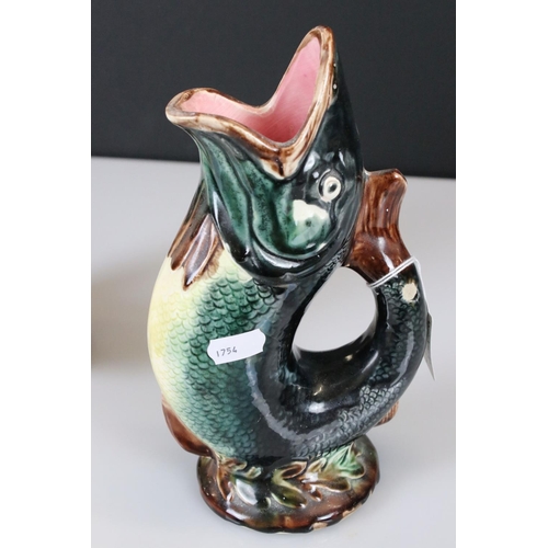 11 - Two Gurgle Jugs, one Royal Winton 22cm high and the other Majolica 22cm high
