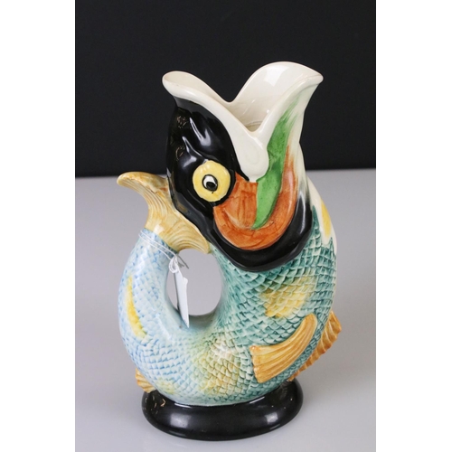 11 - Two Gurgle Jugs, one Royal Winton 22cm high and the other Majolica 22cm high