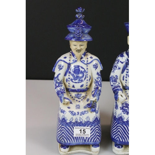 15 - Two Chinese Blue and White Figures of Seated Emperors, character marks to base, 33cm high