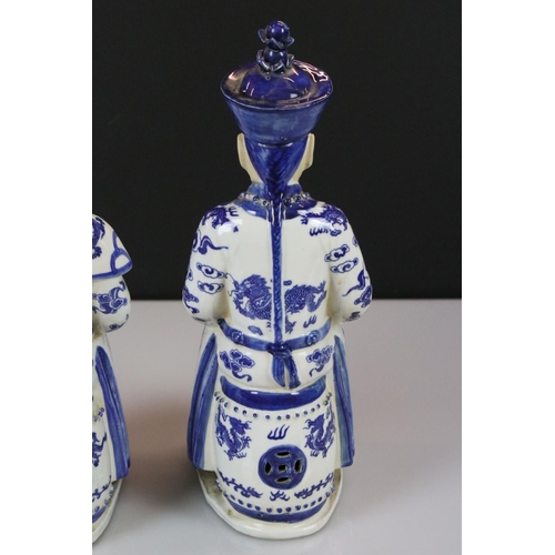 15 - Two Chinese Blue and White Figures of Seated Emperors, character marks to base, 33cm high
