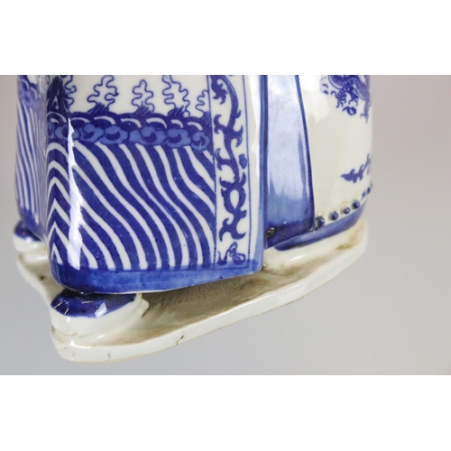 15 - Two Chinese Blue and White Figures of Seated Emperors, character marks to base, 33cm high