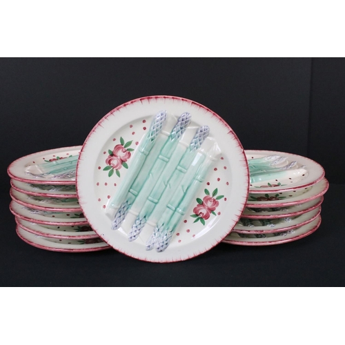 38 - Set of Twelve French Faience Asparagus Plates, each with moulded relief decoration of seven asparagu... 