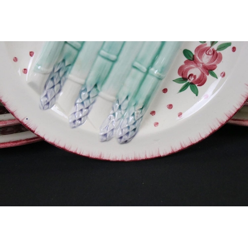 38 - Set of Twelve French Faience Asparagus Plates, each with moulded relief decoration of seven asparagu... 