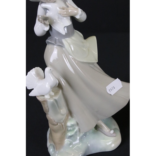 42 - Two Lladro Girls, one with two geese and the other with two doves, tallest 28cm high