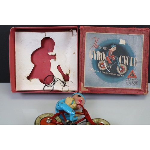 282 - Boxed Triang Gyro Cycle tin plate & celluloid toy, cord loose, model gd, box with seam split to one ... 