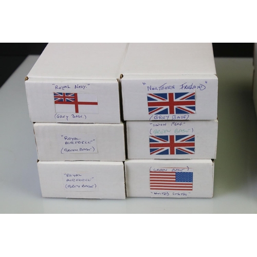 290 - 14 Boxed The British Toy Soldier Company metal flags on poles with stands to include Irish flag, Roy... 