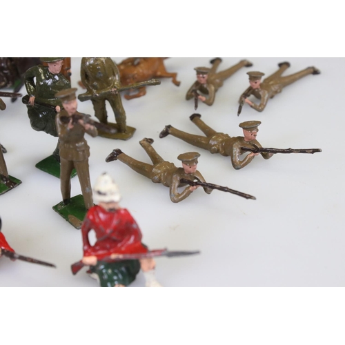 302 - Collection of early-mid 20th C military metal figures, many Britains examples, include Jo Hill motor... 