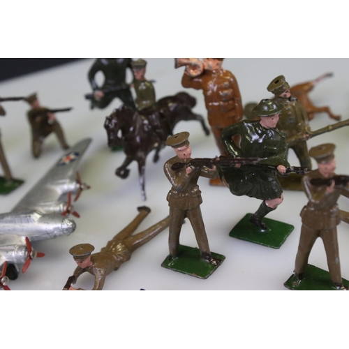 302 - Collection of early-mid 20th C military metal figures, many Britains examples, include Jo Hill motor... 