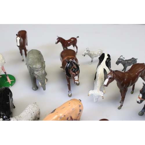 303 - Approximately 24 Painted Metal Farm and Zoo Animals including Britains