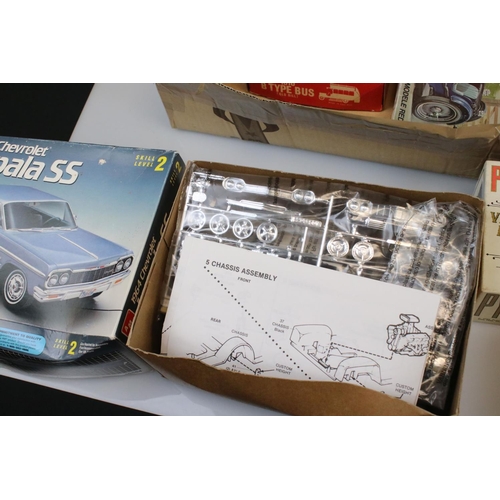 205 - Nine boxed plastic model kits to include AMT ERTL 1964 Impala SS, Puro Vintage Brass Car, Revell H16... 