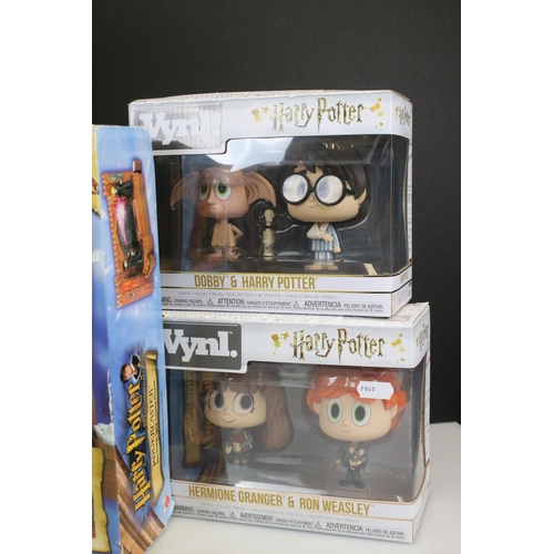 248 - Five boxed Funko Vynl. Harry Potter collectibles to include Rubeus Hagrid & Harry Potter, Dobby & Ha... 