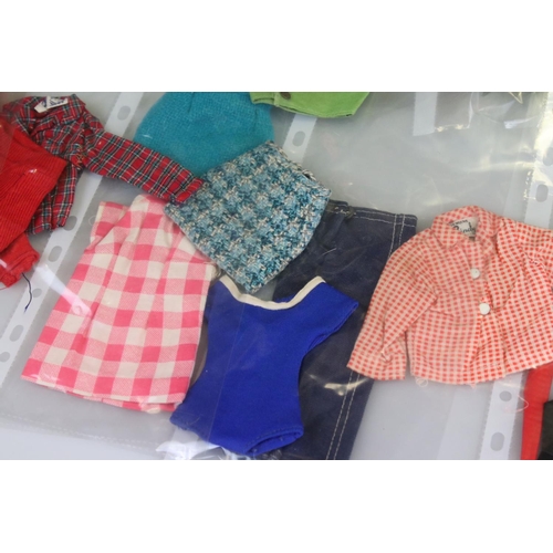 328 - Folder of Doll's Clothing and Accessories including 1960's Pedigree Sindy and comprising approx. 14 ... 