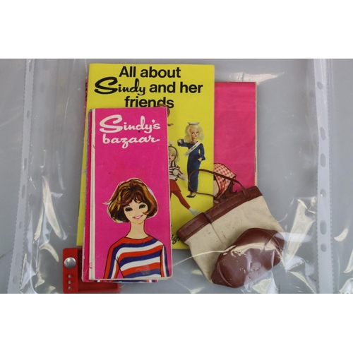 328 - Folder of Doll's Clothing and Accessories including 1960's Pedigree Sindy and comprising approx. 14 ... 