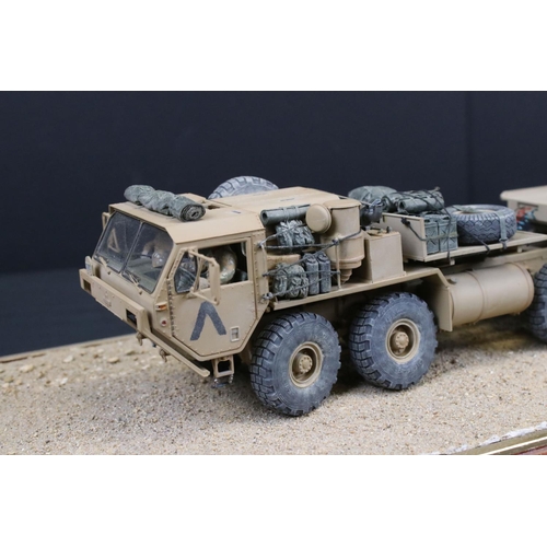 424 - Two cased plastic kit built military models, very well made with diorama scenery, plastic case lengt... 