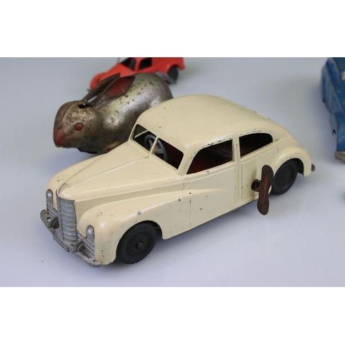 509 - Seven mid 20th C tin plate and plastic models to include Mettoy clockwork saloon in cream, Weekin cl... 