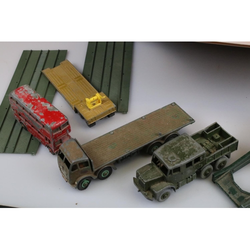 551 - Large quantity of heavily play worn mid 20th C diecast models to include Corgi & Dinky featuring com... 