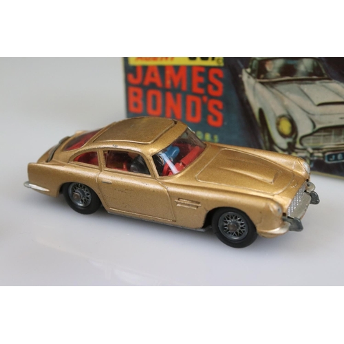 560 - Boxed Corgi 261 James Bond Aston Martin DB5 diecast model with ejector figure, some paint chips but ... 