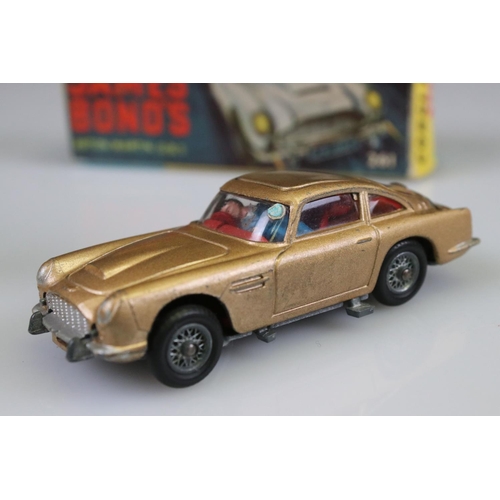 560 - Boxed Corgi 261 James Bond Aston Martin DB5 diecast model with ejector figure, some paint chips but ... 