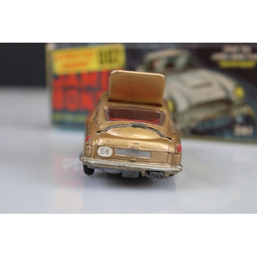 560 - Boxed Corgi 261 James Bond Aston Martin DB5 diecast model with ejector figure, some paint chips but ... 