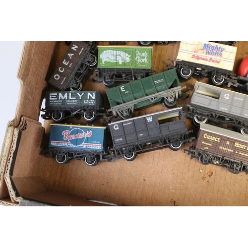 82 - Approximately 45 OO gauge items of rolling stock featuring carriages and wagons including Hornby, Wr... 