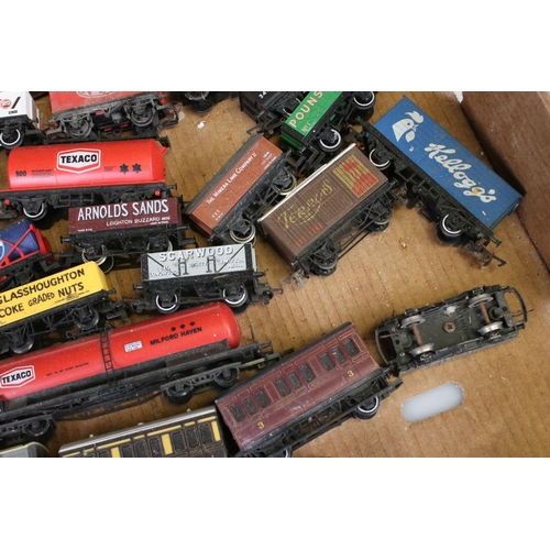 82 - Approximately 45 OO gauge items of rolling stock featuring carriages and wagons including Hornby, Wr... 