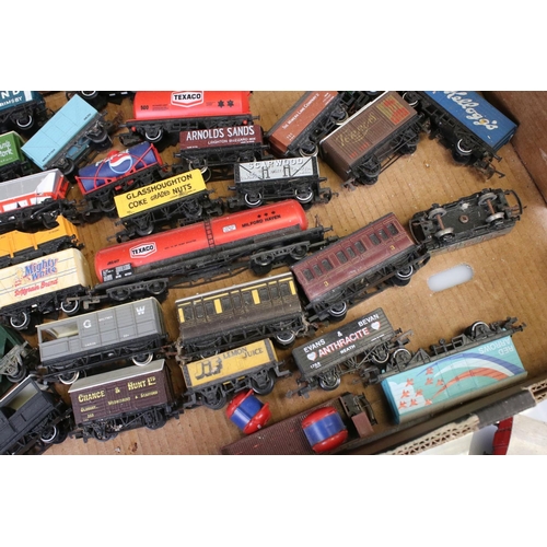 82 - Approximately 45 OO gauge items of rolling stock featuring carriages and wagons including Hornby, Wr... 