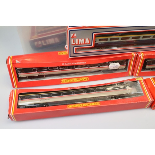 87 - 13 Boxed OO gauge items of rolling stock to include 5 x Hornby and 8 x Lima examples, all coaches