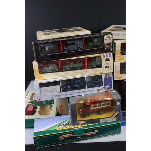 422 - 32 Boxed diecast models to include Lledo (Royal Wedding, US Army, The Home Front, etc), Corgi, Atlas... 