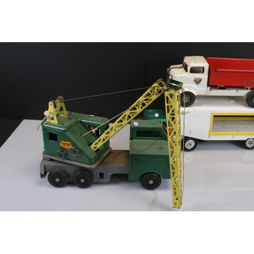 486 - Four large tin plate model toys to include Triang truck, Tonka Motor Mover, Marx High Lift Mobile Cr... 