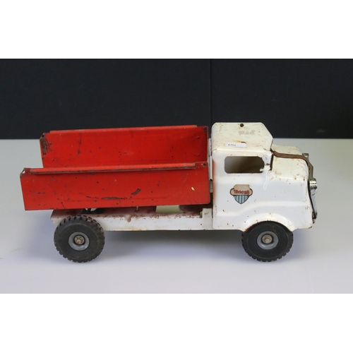 486 - Four large tin plate model toys to include Triang truck, Tonka Motor Mover, Marx High Lift Mobile Cr... 